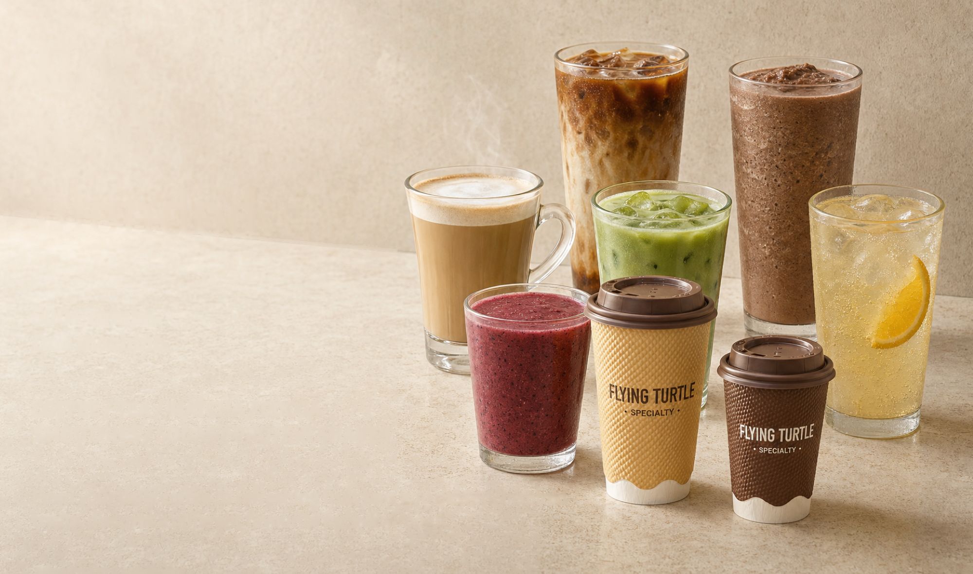 A cappuccino, iced latte, matcha, berry smoothie, chocolate frappé and citrus soda beside Flying Turtle cups