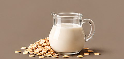 Jug of oat milk with oats