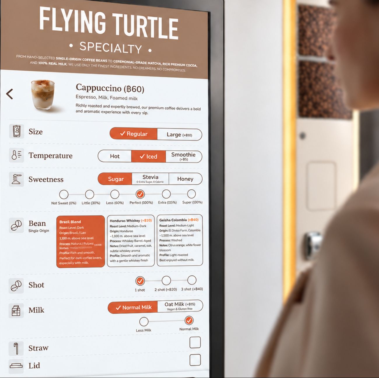 The Flying Turtle touchscreen showing a cappuccino with size, temperature, sweetness, bean, shot and milk options